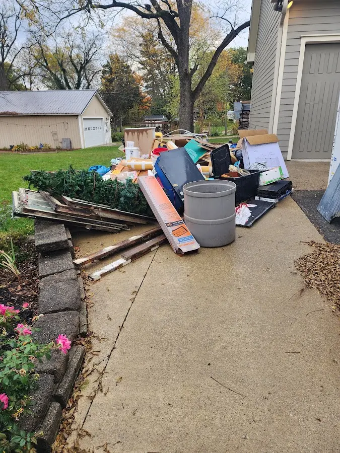 Dumpster being loaded with debris for 30 Yard Dumpster Rental in Green Bay